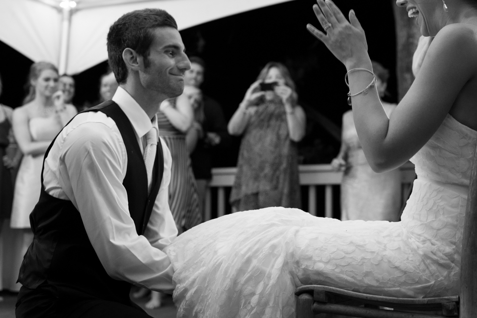 laughing groom removing garter in style