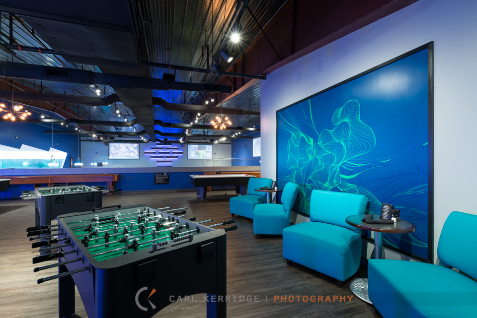 Lifestyle photography of the games area at 710 Bowling Alley, interior designs by e3 studios
