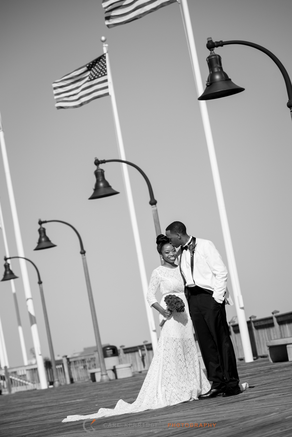 Black and white posed couple on the Myrtle Beach Boardwalk