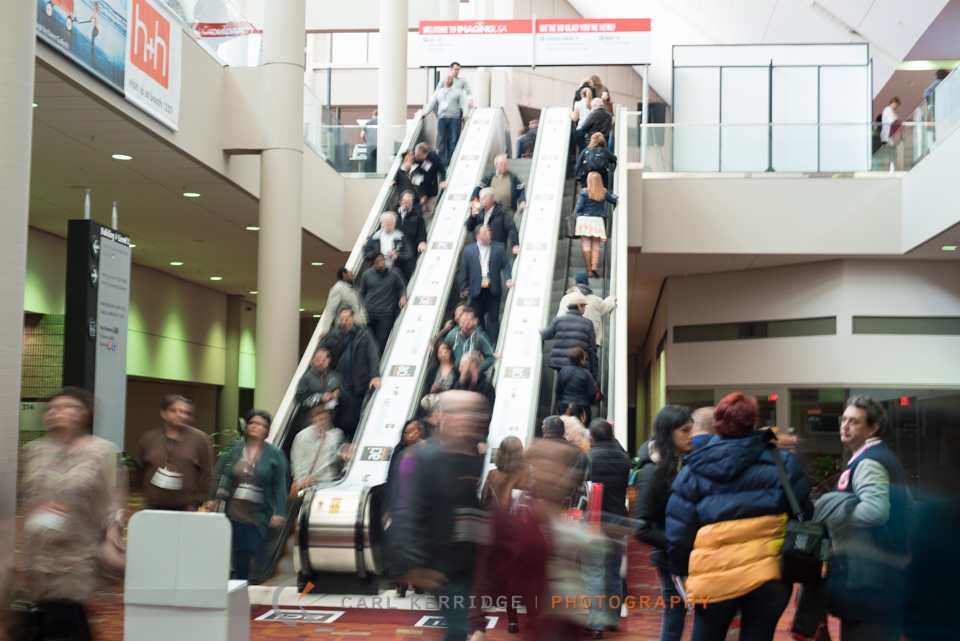 Escalator filled with people at Imaging USA