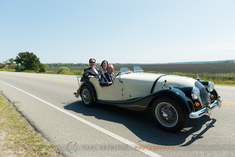Marries couple cruising in an old Morgan across the Inlet in Litchfield Beach