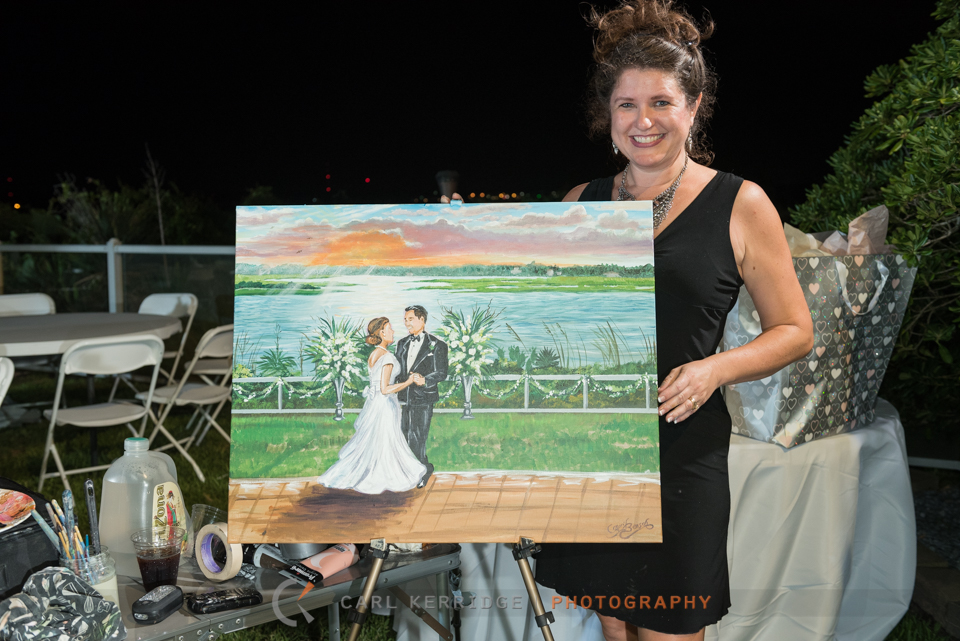 Live painting portrait of the bride and groom dancing at their elegant wedding