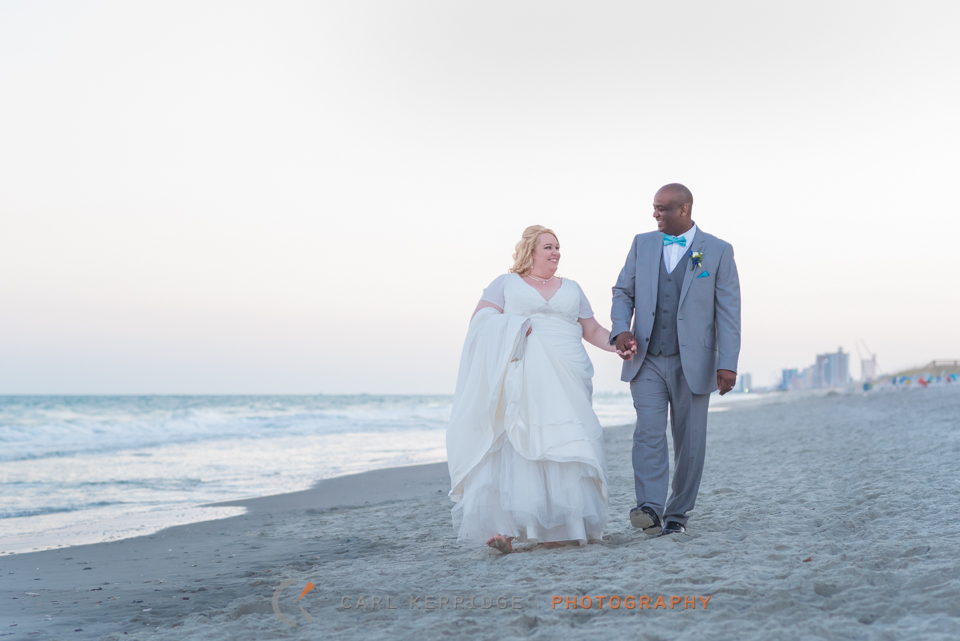 couple portraits of the bride and groom on the beach after their Wedding Carriage Ride