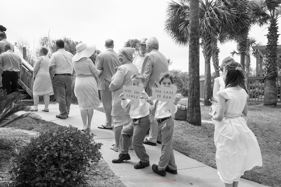 Wedding details, black and white wedding of ring bearers holding signs in Myrtle Beach
