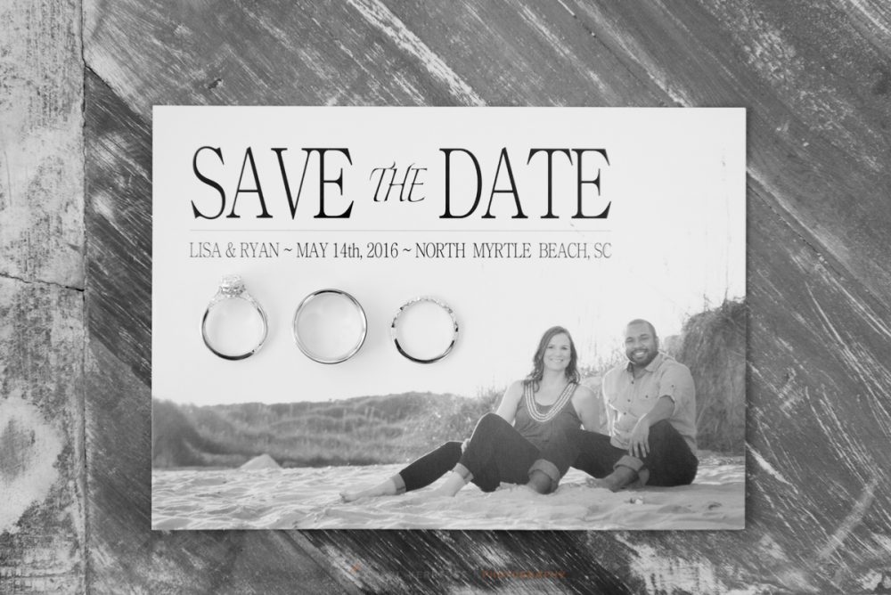 save the date invitation from the bride and groom with there wedding rings placed on top for a black and white image
