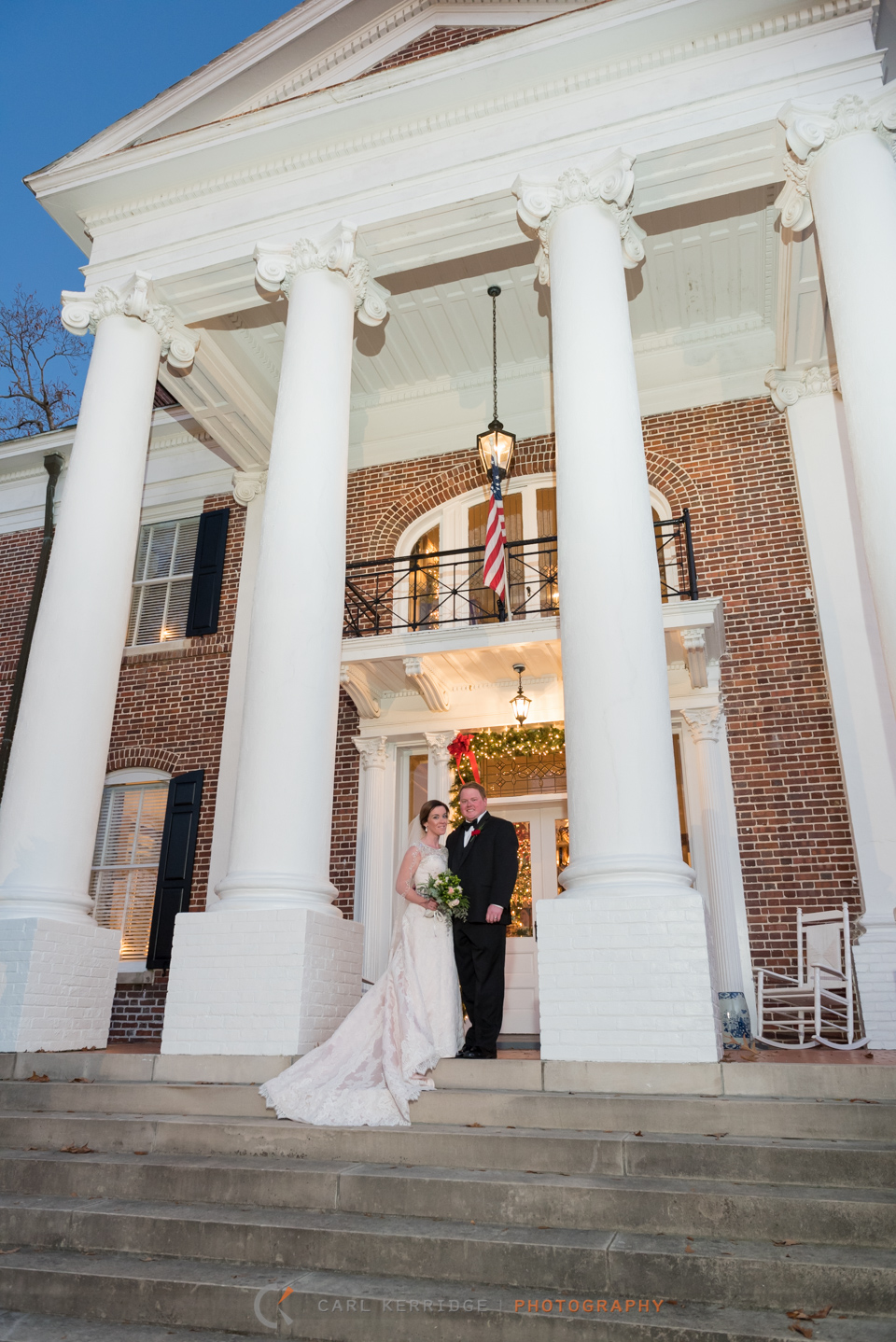 bride and groom in front of rosewood manor after their wedding, wedding give away photo