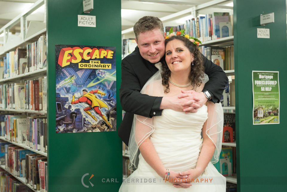 wedding couple pose in the library for wedding photos, wedding give away photo