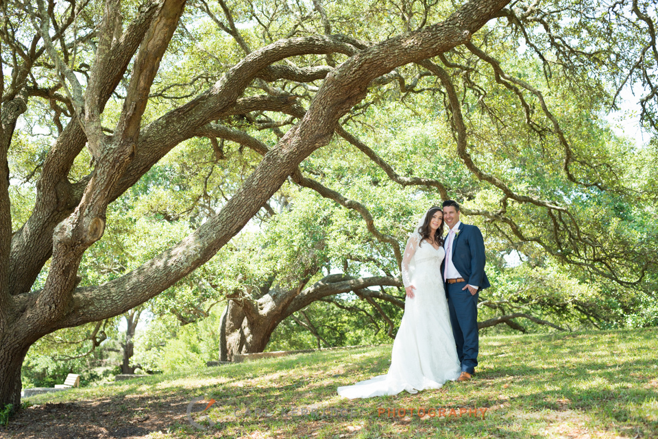 husband and wife posing for couple portraits after their myrtle beach wedding at myrtle beach state park