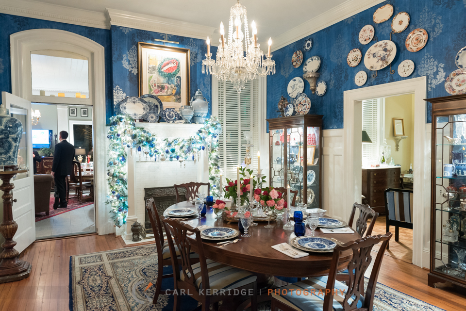 A lovely setting in the Rosewood Manor's dining room, crafted with hues of blue and trimmed with frosted christmas decorations