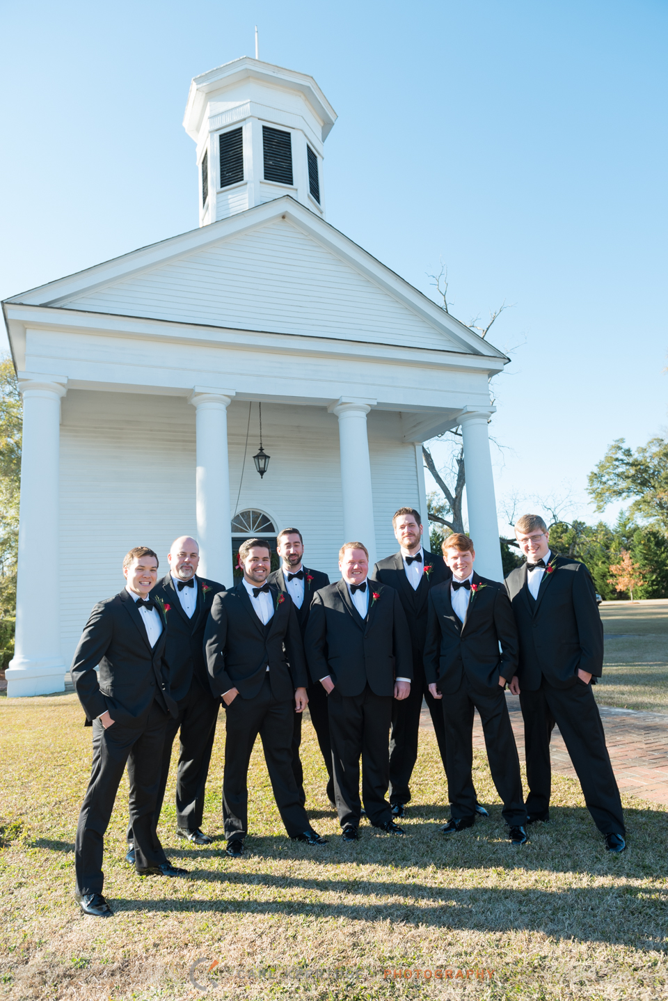 The groom and his groomsmen pose in front of the First Presbyterian Church in Marion, South Carolina
