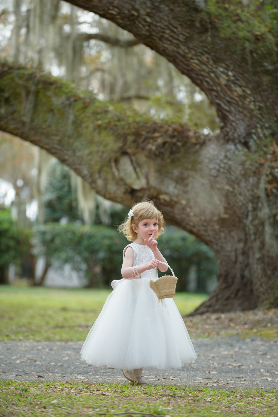 flower girl poses for Litchfield Wedding portraits before the ceremony