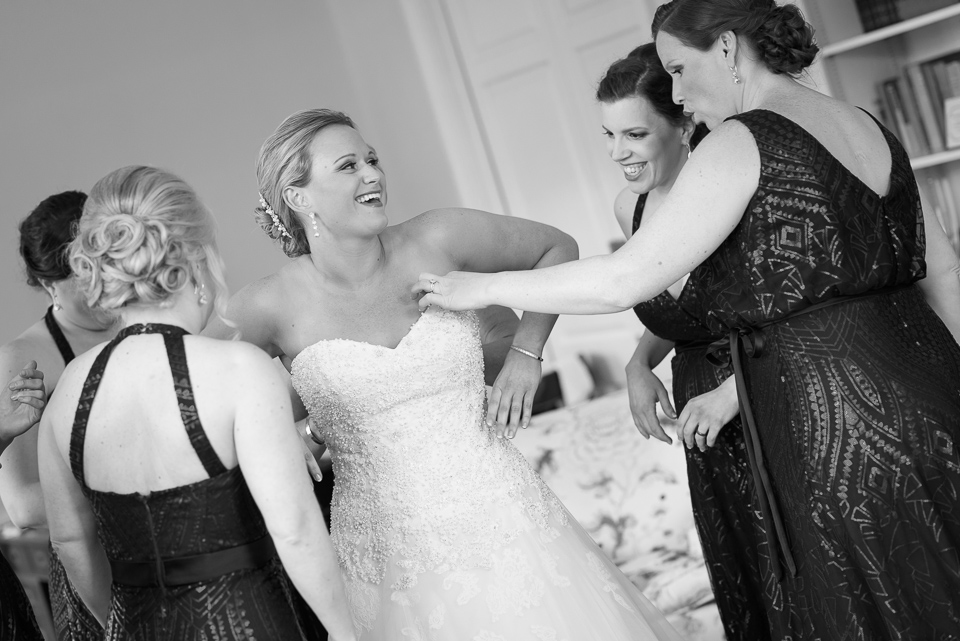 bride laughs with her bridesmaids before her Litchfield Wedding