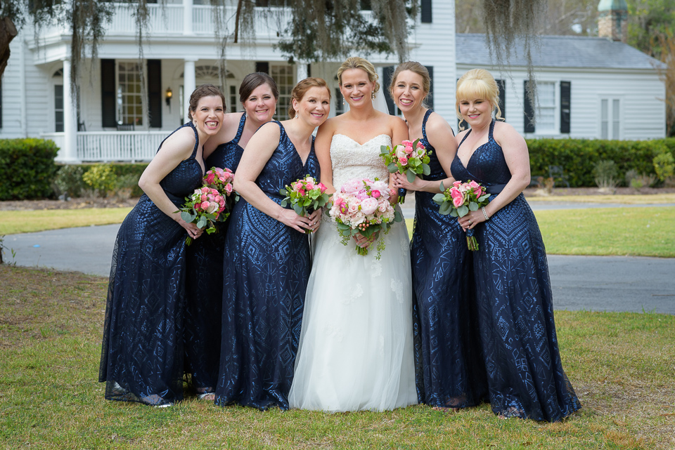 bride poses with her bridesmaids before her Litchfield Wedding