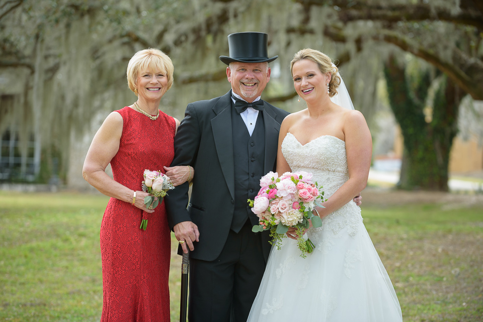 mother, father and bride pose for their photographer and Litchfield Wedding portraits