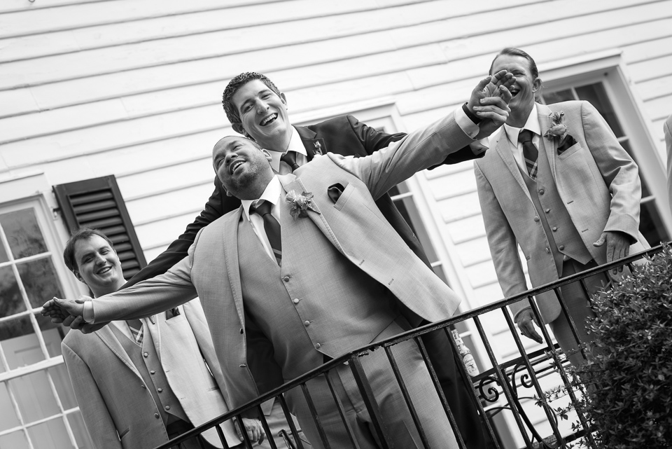 groom and groomsman pose for a silly candid during Litchfield Wedding portraits